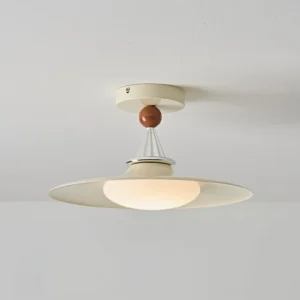 Eden ceiling lamp in cream color with warm brown decorative sphere, illuminated overhead view