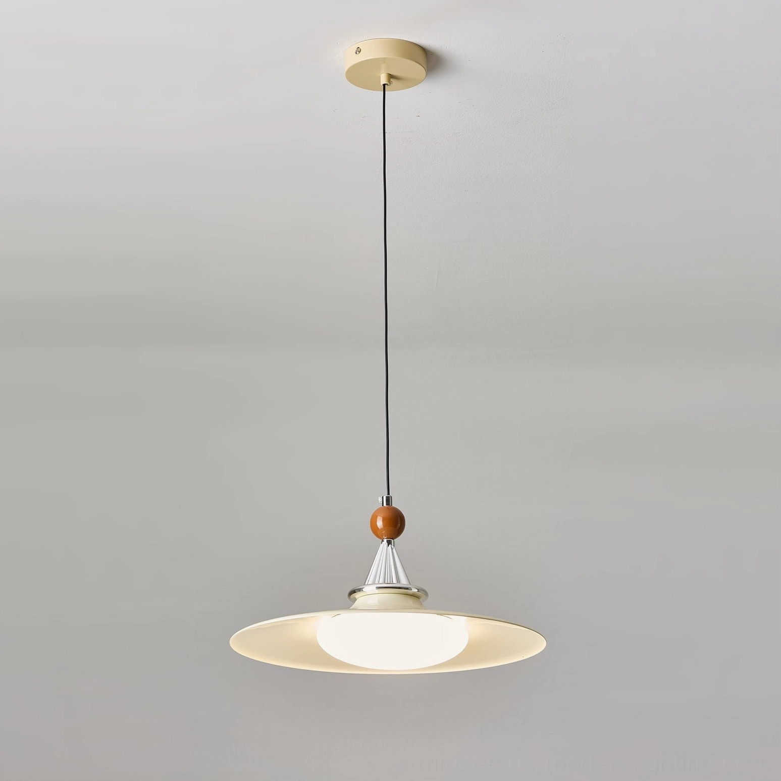 Cream colored minimalist pendant with warm LED light in contemporary interior