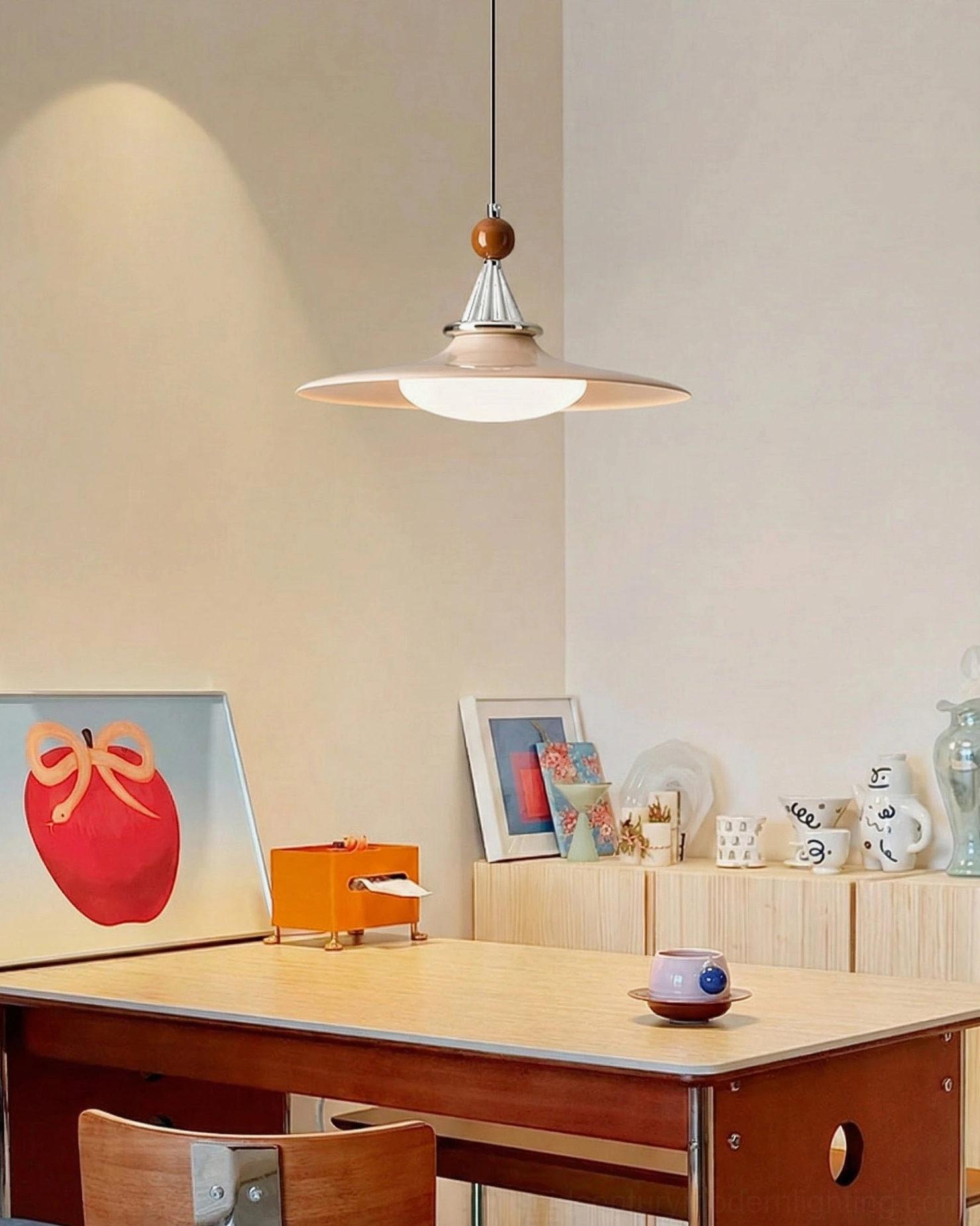 Beige minimalist pendant light in home office setting with warm ambient glow