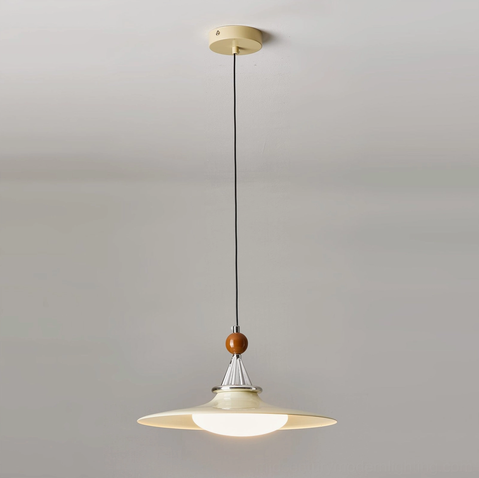 Cream colored mid-century pendant light with silver metal details and wooden top bead