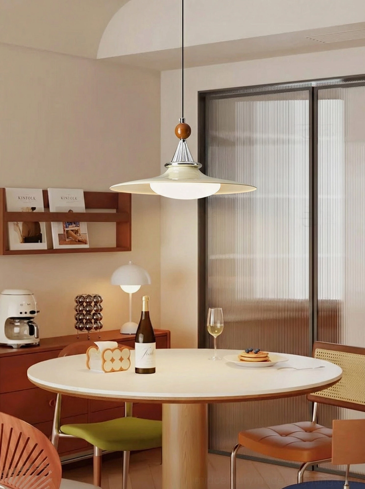 Minimalist beige pendant light with clean lines in modern dining room