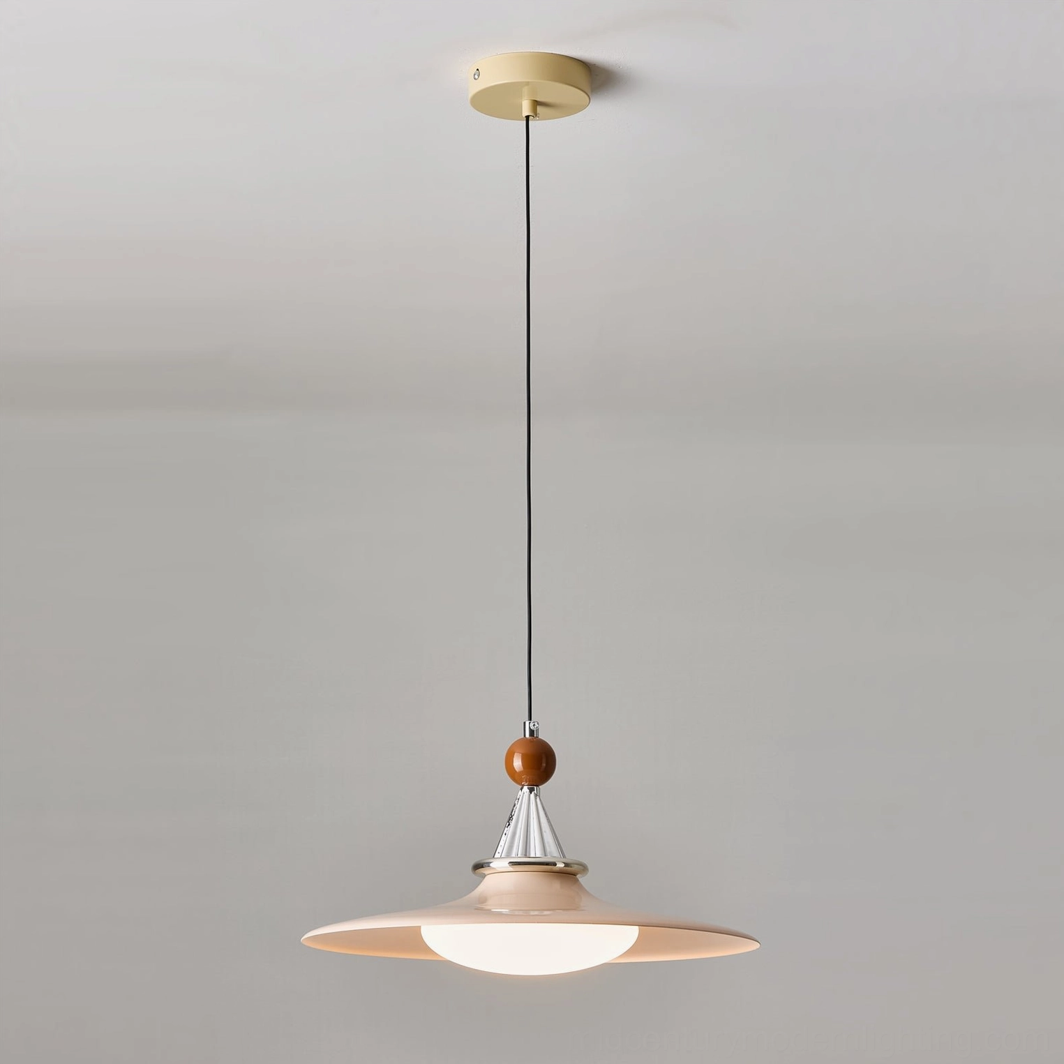 Mid-century modern pendant lighting installation showing cord and ceiling mount