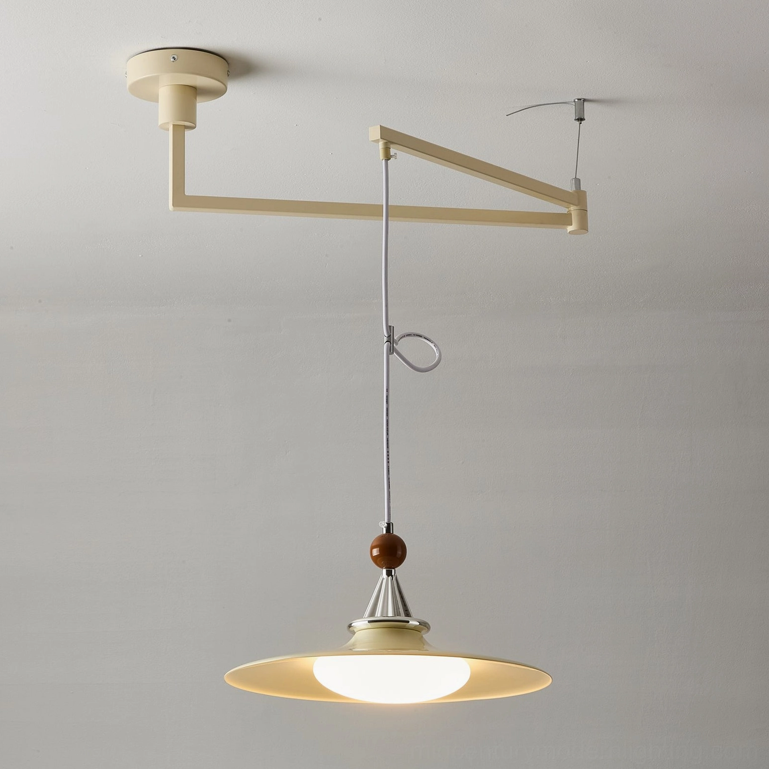 Eden swing arm pendant light installation detail showing ceiling mounting bracket and adjustable cord arrangement for mid-century interior