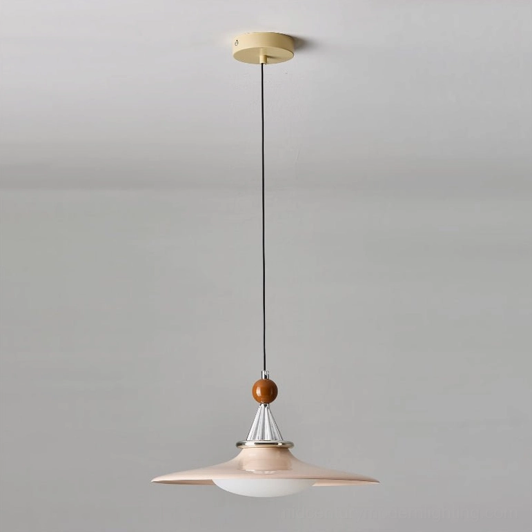 Pink mid-century pendant light with retro 1950s inspired design studio view