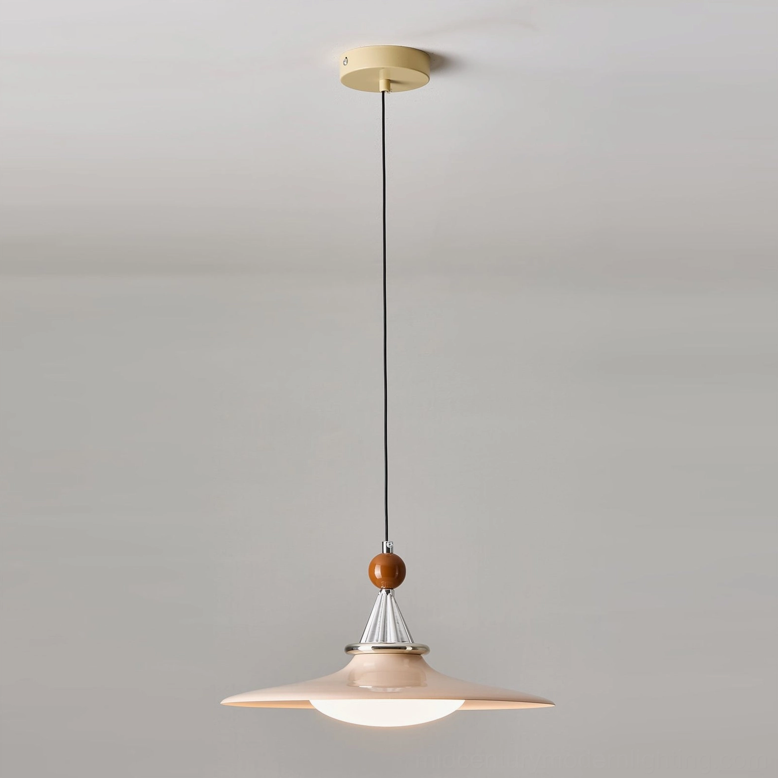 Pink pendant light creating warm ambient lighting in residential space