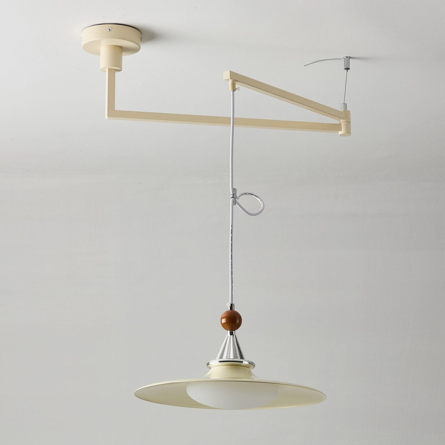 Eden cream swing arm pendant light with metal frame and light beige wooden shade, detailed studio frontal view showing finish quality
