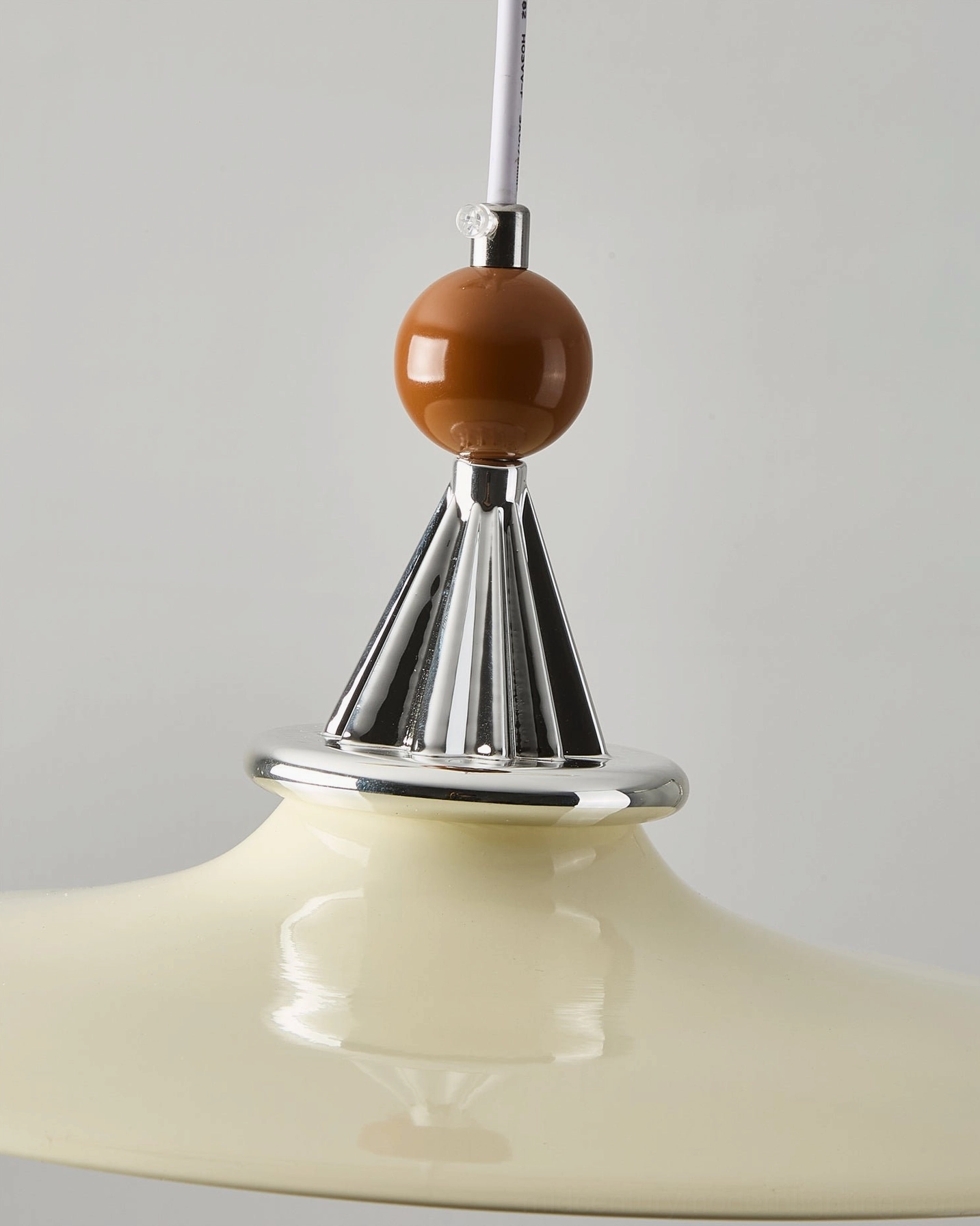 Mid-century modern swing arm pendant light showing full articulation range and geometric form from multiple viewing angles
