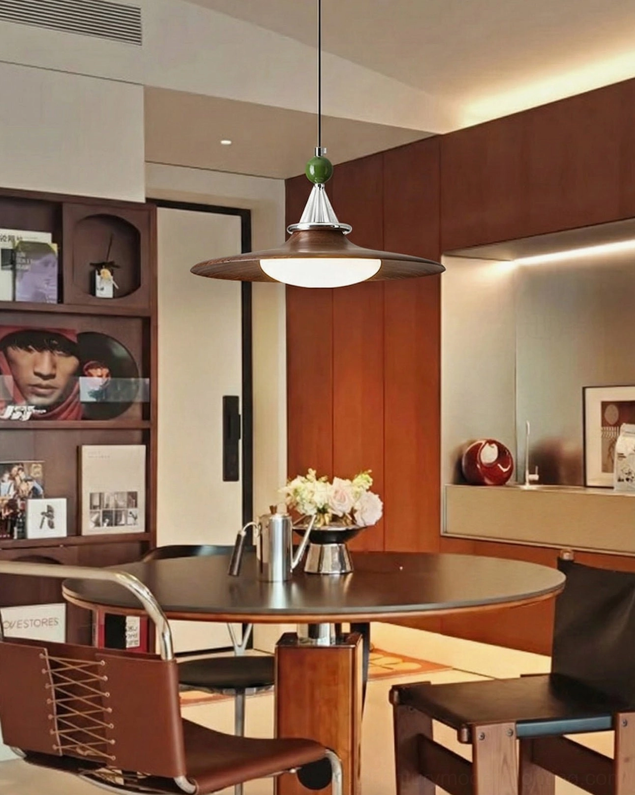 Dark walnut disc pendant light in retro vintage dining space with cozy atmosphere