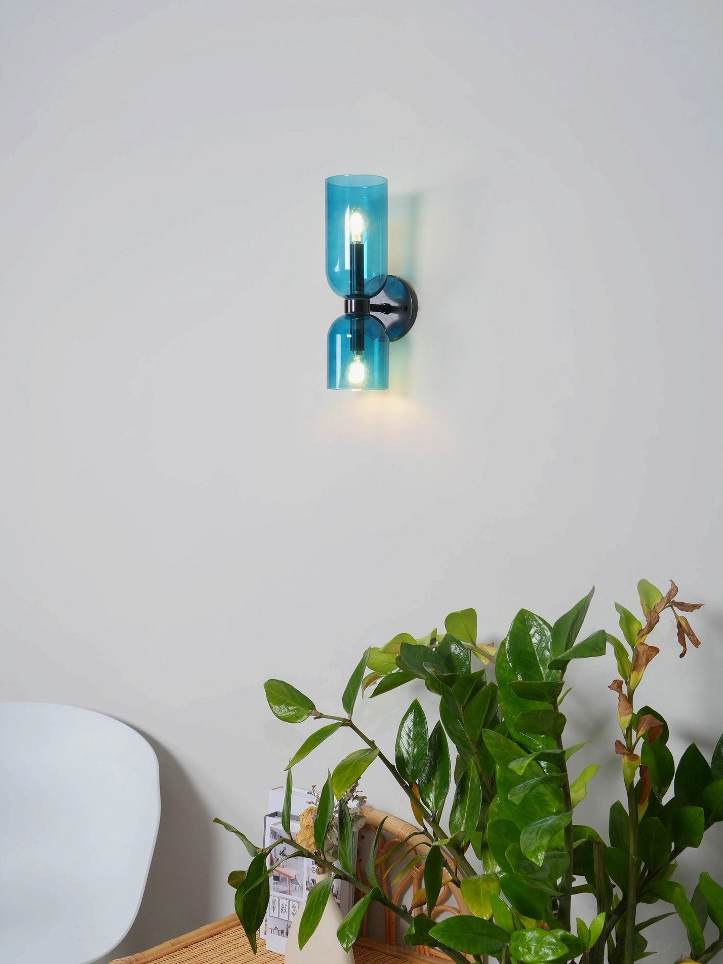Artistic blown glass wall lamp showcasing translucent shade and refined metal base architecture