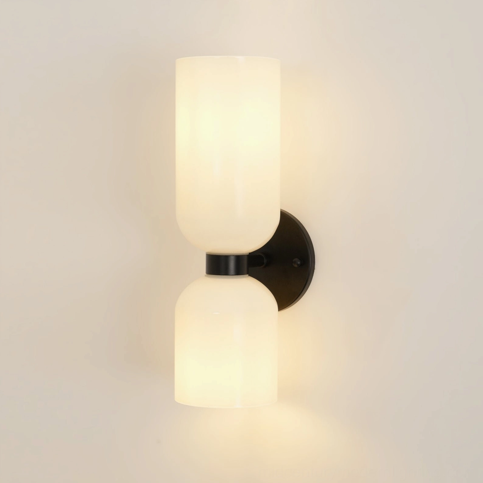 Modern blown glass wall lamp with clear shade and elegant brass frame detail shot