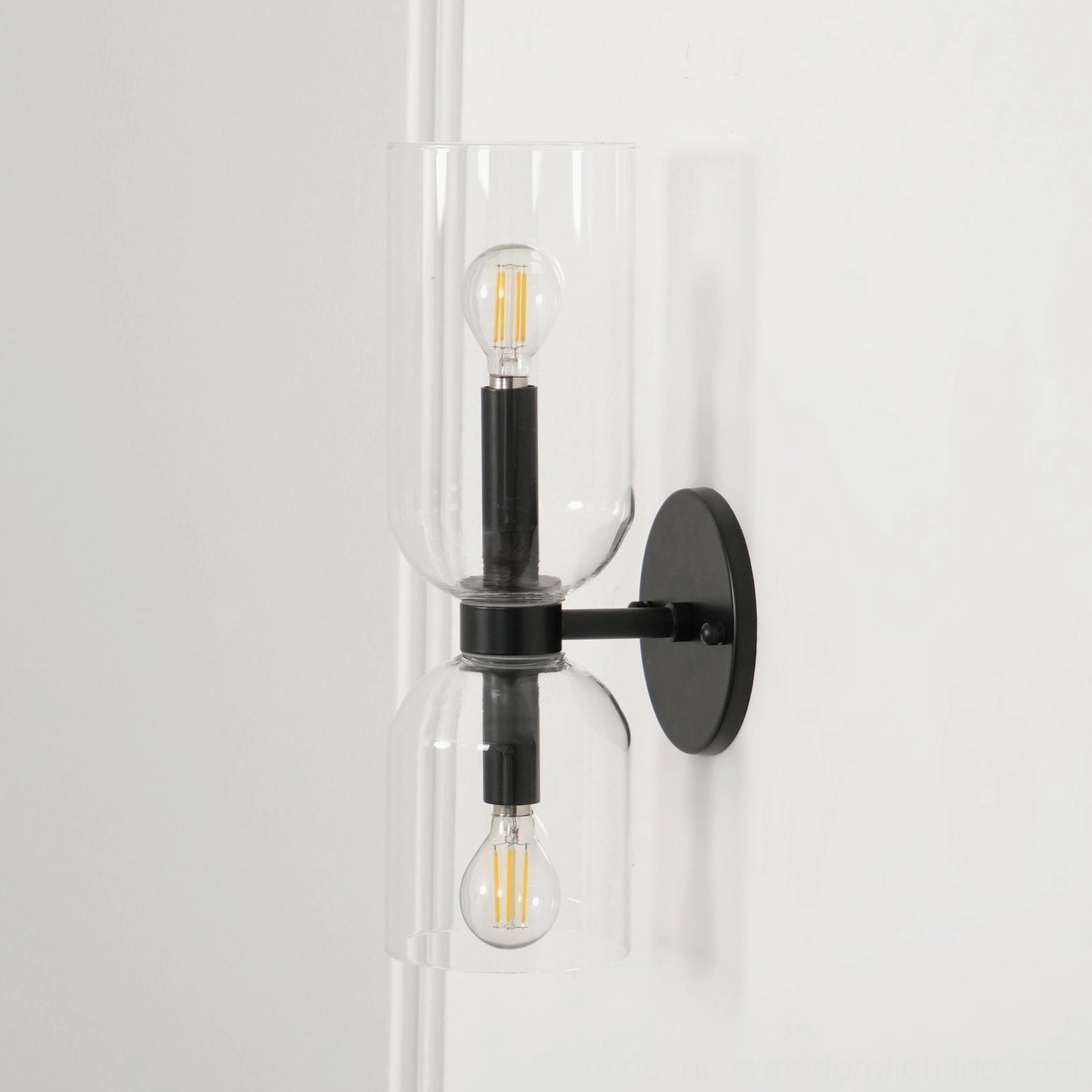Edie blown glass sconce product shot showing white frosted shade with polished gold metal base