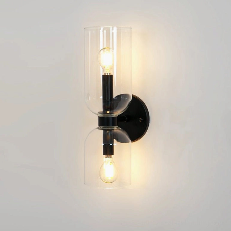 Designer wall lamp with clear transparent glass and matte black frame contemporary aesthetic