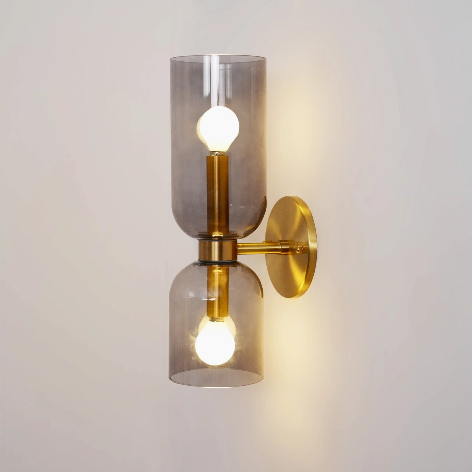 Mid-century modern wall sconce with clear transparent glass and refined brass metal base