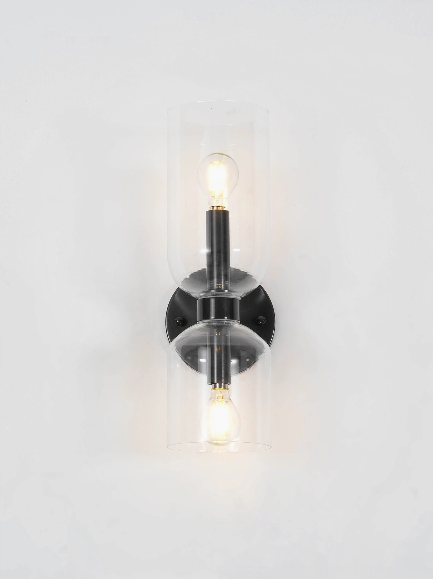 Mid-century sconce with smoked glass creating sophisticated shadow play and ambient glow on wall