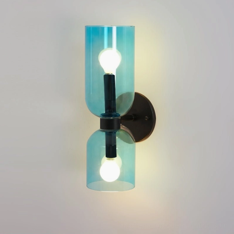 Modern sconce with cobalt blue hand-blown glass shade creating striking color accent lighting