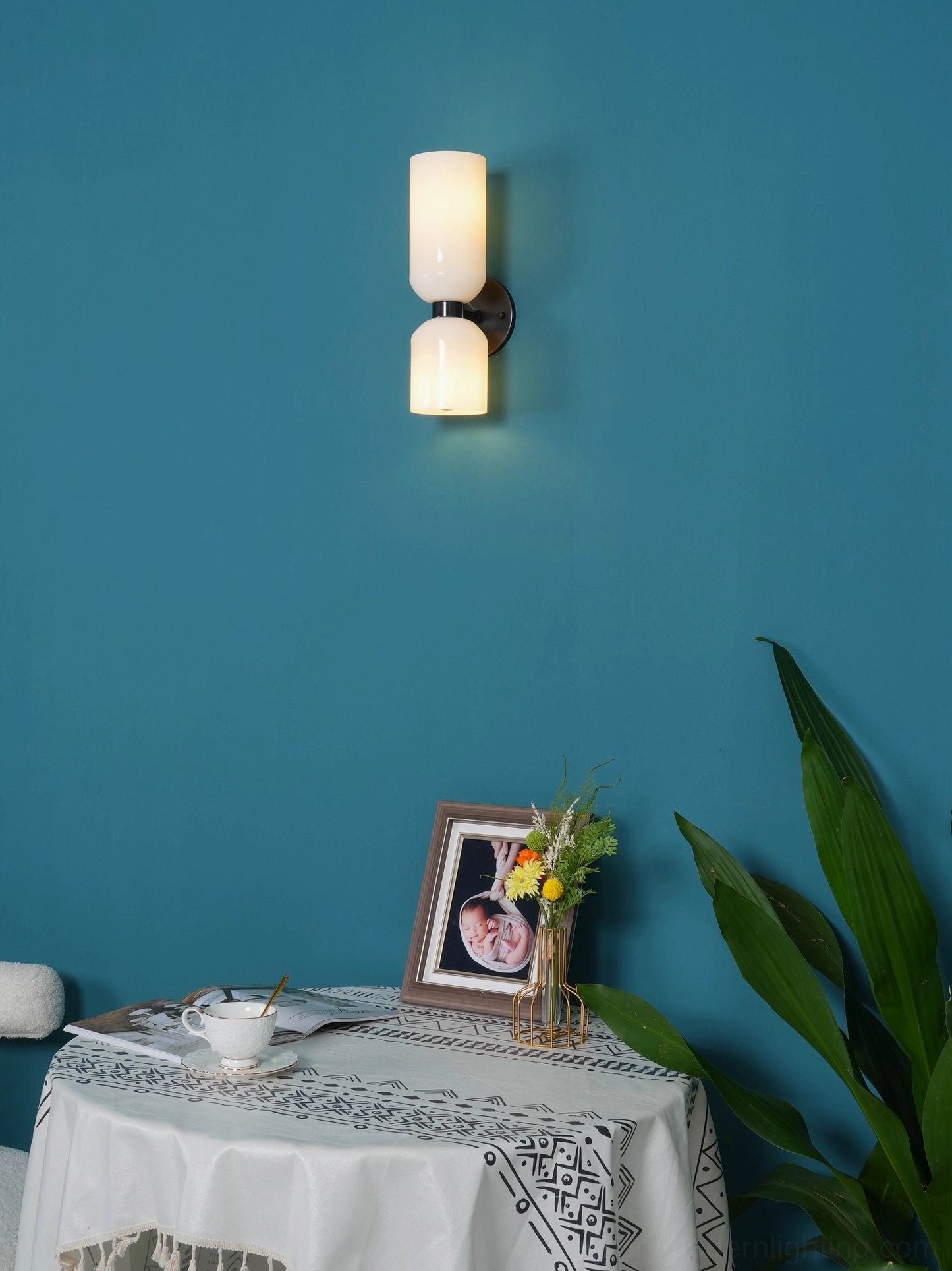 Edie blown glass sconce detail showing craftsmanship of hand-blown glass shade with metal base