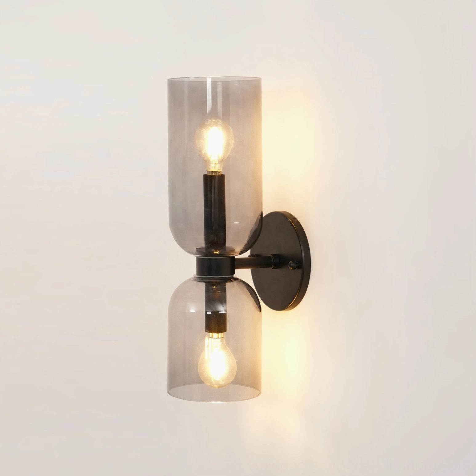 Edie wall sconce product display with smoked grey glass and architectural metal mounting system