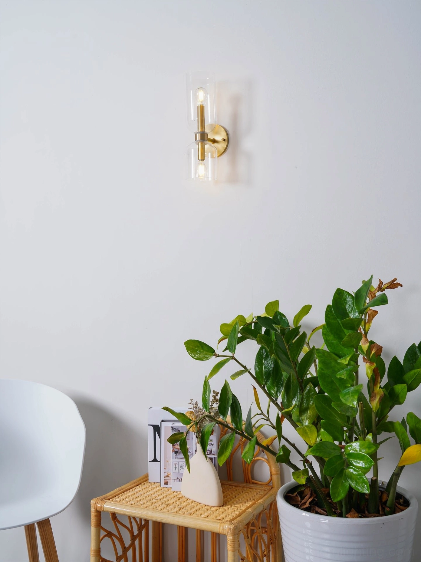 Designer wall sconce with smoked glass shade demonstrating sophisticated light quality and architectural design