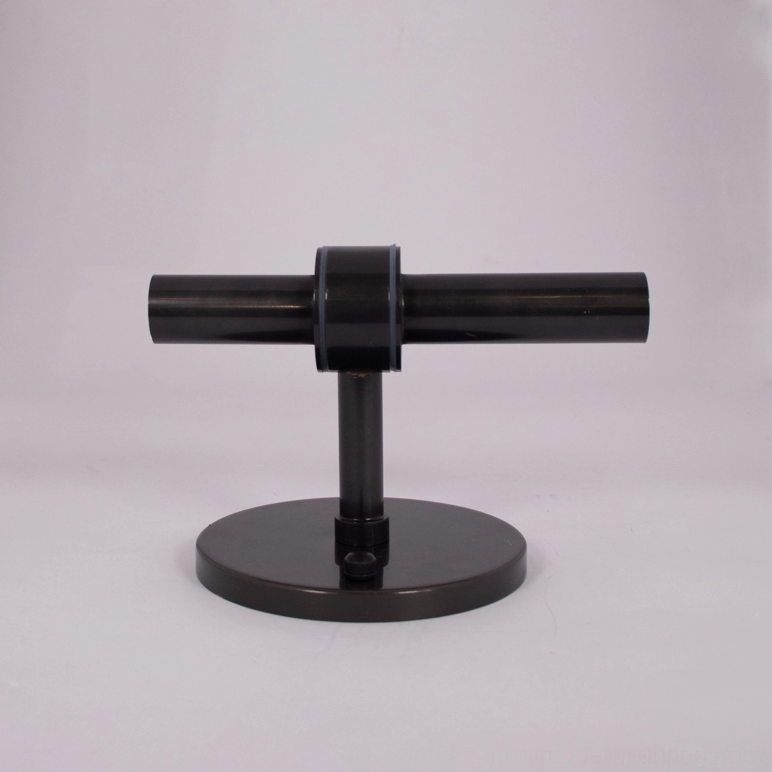 Modern Edie wall sconce installed in contemporary interior with clear glass and warm illumination