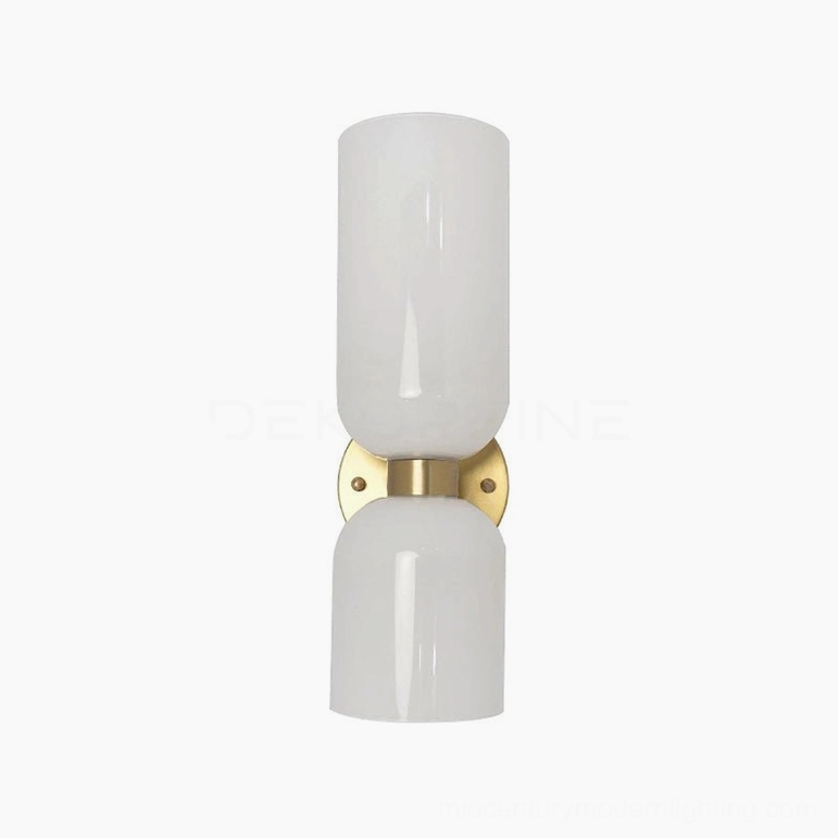 Edie wall lamp with transparent glass shade and architectural metal frame in living space design
