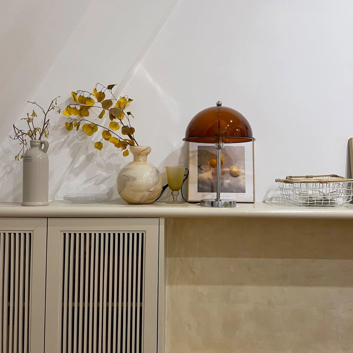Edinburgh table lamp with brown amber acrylic shade in home cabinet display, mid-century modern design