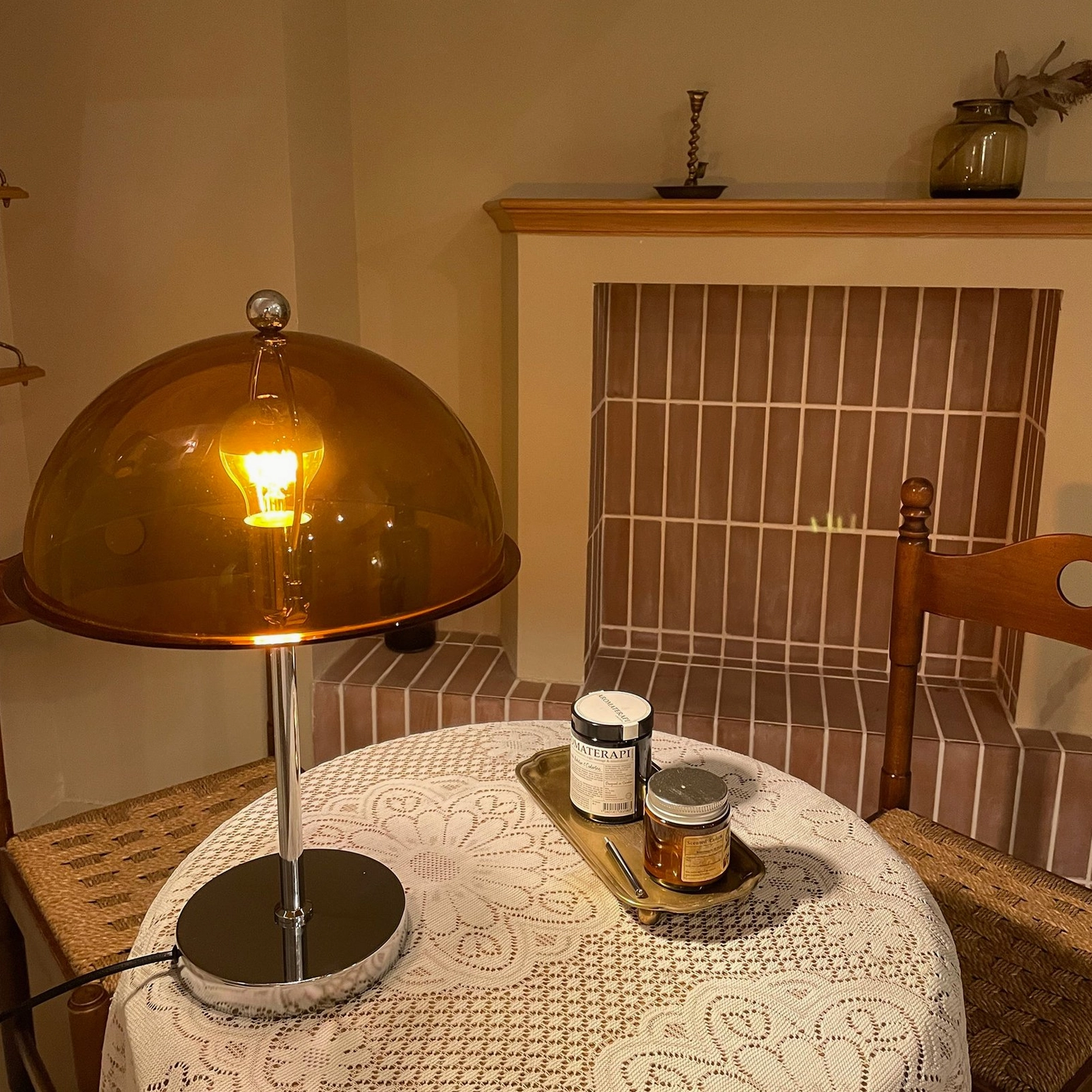 Edinburgh table lamp cream acrylic shade with warm bulb creating cozy living room ambiance