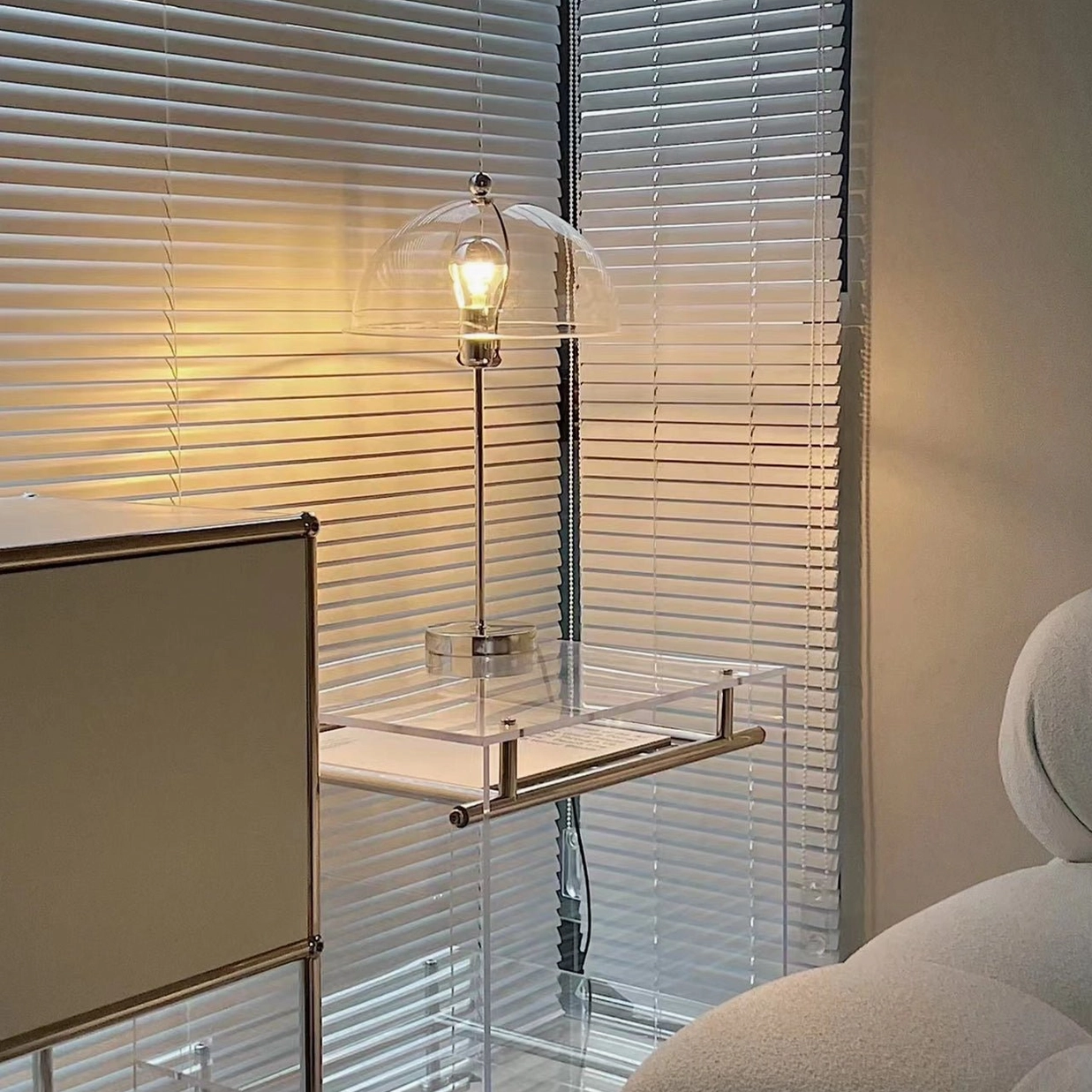 Edinburgh table lamp cream white shade creating gentle ambient glow on bedroom dresser