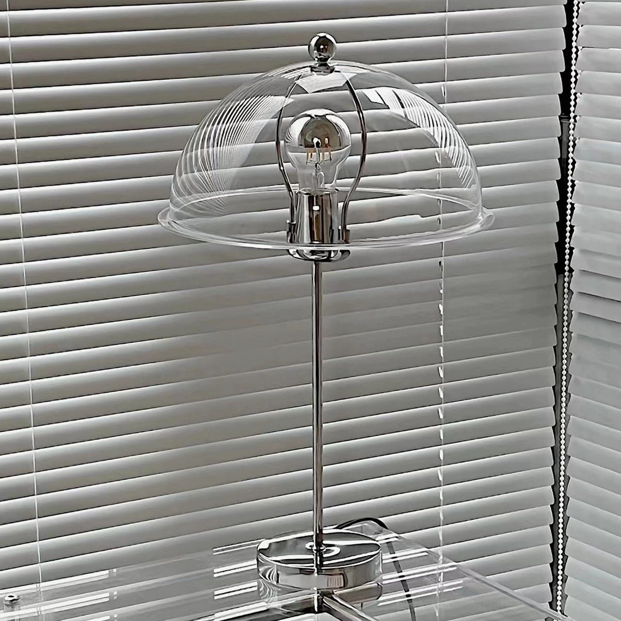 Edinburgh table lamp green sage shade in study or library setting with warm ambient glow