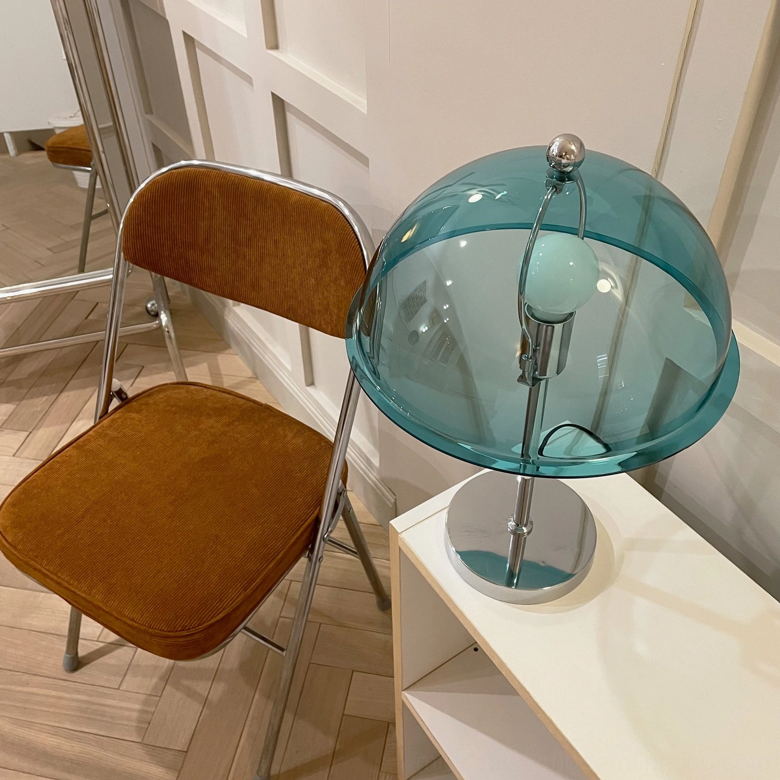 Edinburgh table lamp showing polished silver metal frame precision geometry and acrylic dome structure