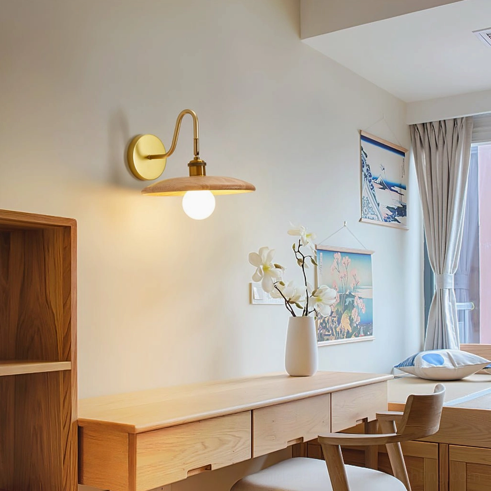 Edmund mid-century wall lamp above vanity workspace with wooden furniture and home decor