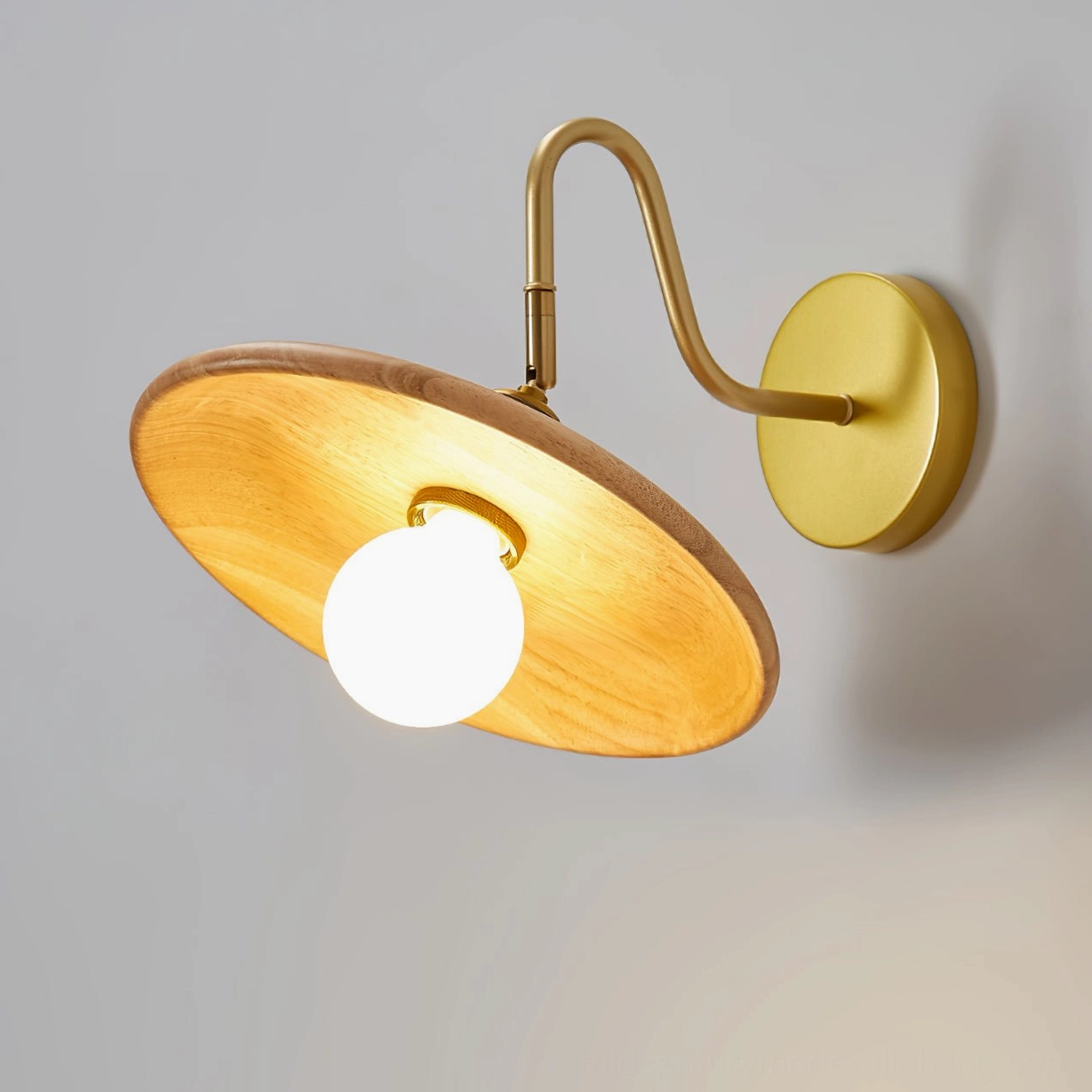 Edmund wooden wall sconce side profile showing natural wood grain texture and brass fixture