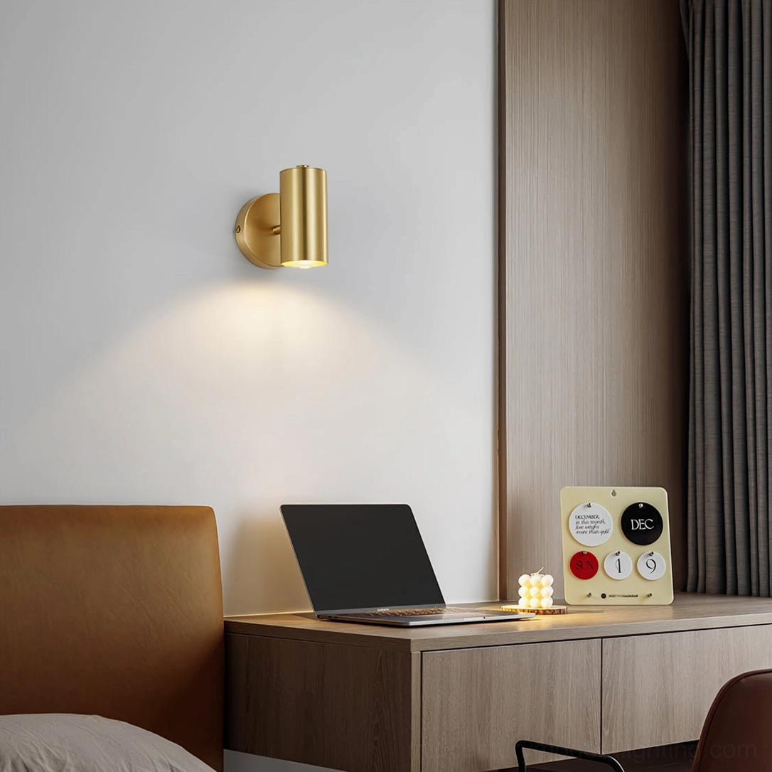 Eduard gold wall sconce mounted in modern bedroom above wooden nightstand with luxury minimalist decor