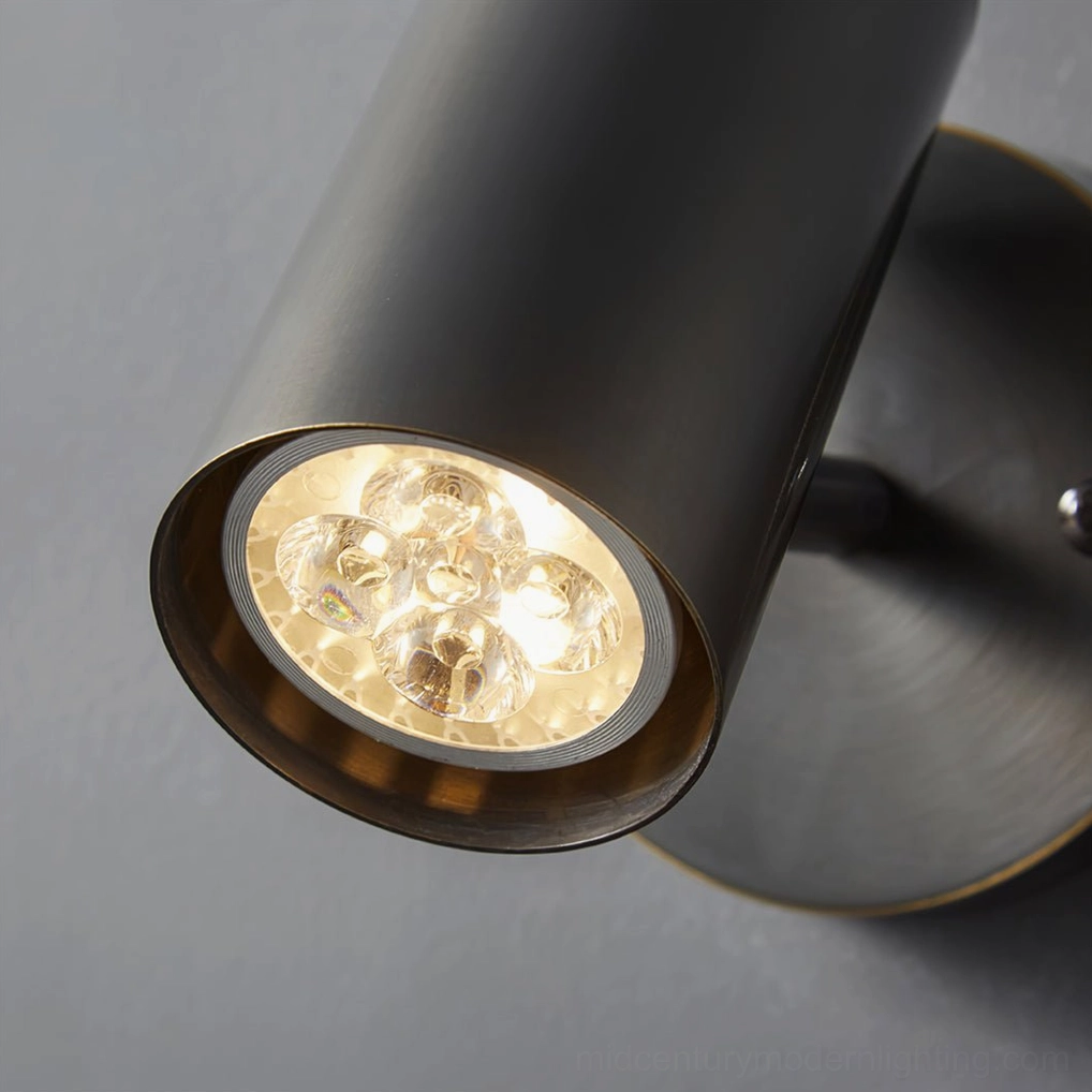 Eduard gold wall sconce modern sculptural form mounted on white wall