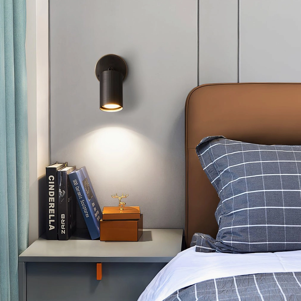 Eduard adjustable wall sconce with articulating head demonstrating vertical and lateral positioning