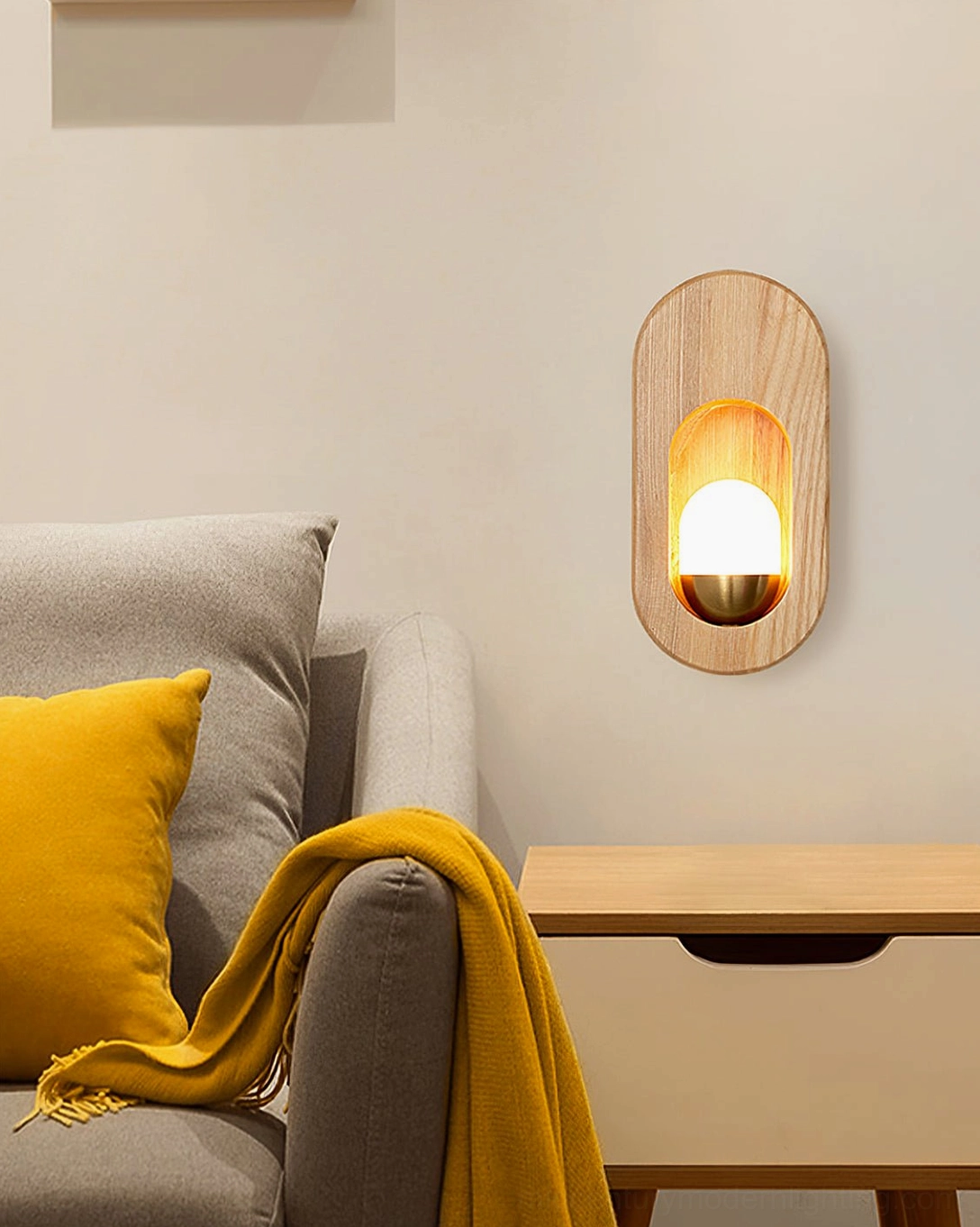 Wooden wall sconce in modern living room with gray sofa and yellow throw pillow accent