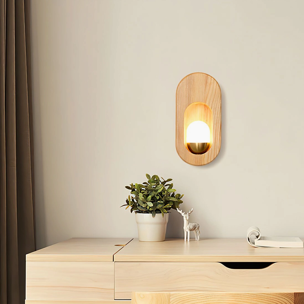 Egg wall sconce product detail with glass shade and wood frame construction close-up