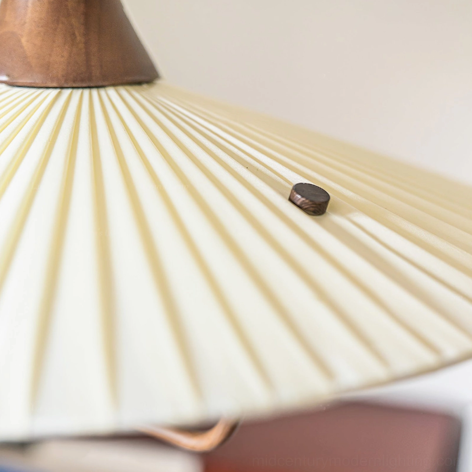 Eikon lamp top fixture detail, wooden accent and walnut metal mounting hardware