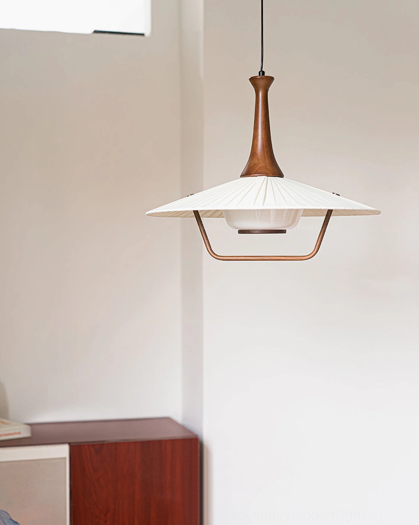 Eikon mid-century pendant lamp in warm dining booth area, front side view mid-century interior