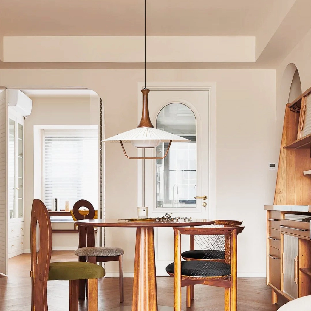 Eikon pendant lamp illuminated in vintage Nordic dining room interior, warm ambient lighting