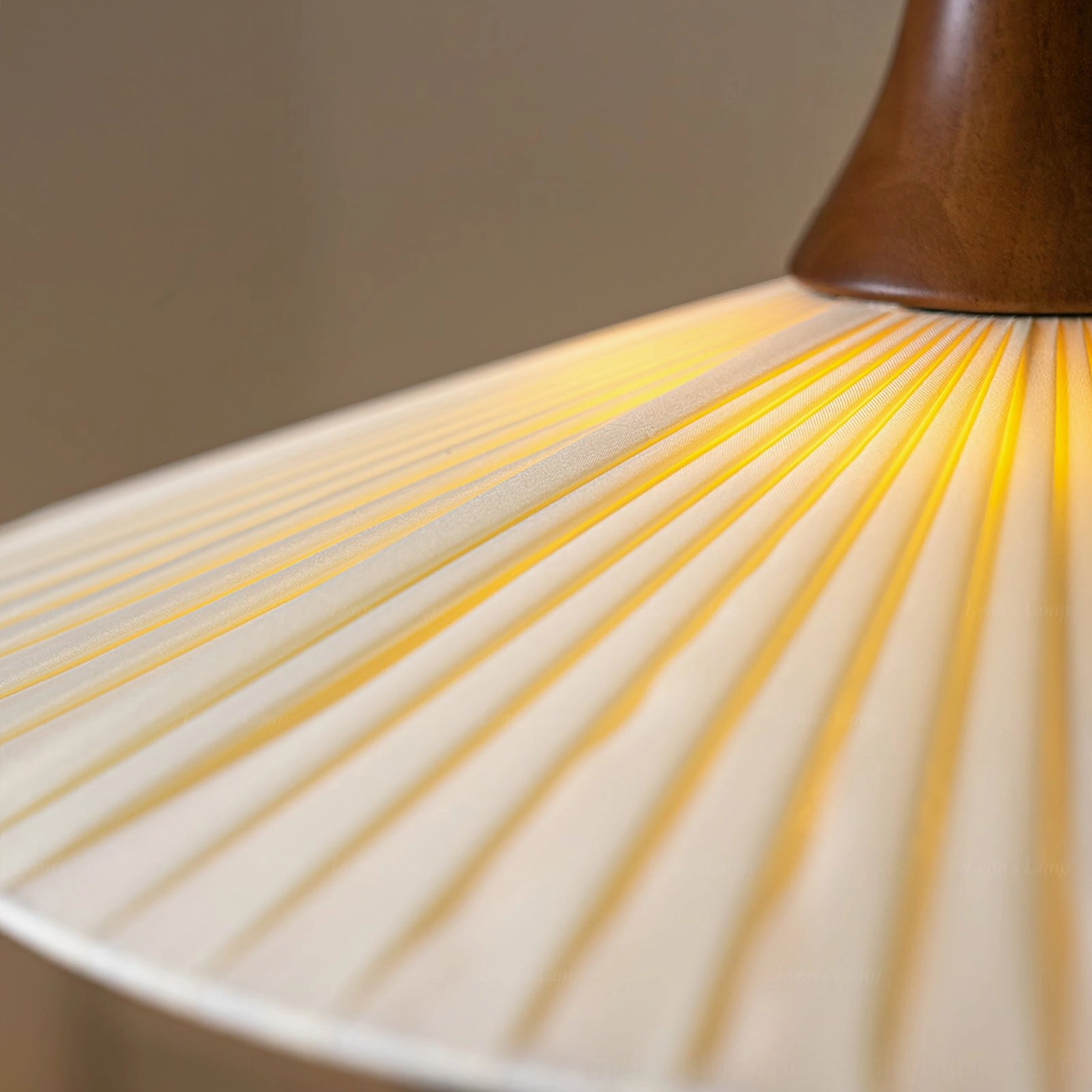 Eikon pendant lamp shade interior detail, radial fabric pleats casting warm diffused light