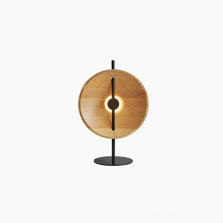 Illuminated Eine natural wood table lamp casting warm light and geometric shadows, minimalist scandinavian design aesthetic