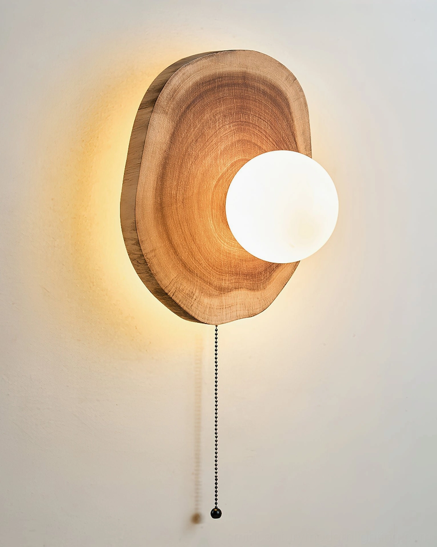 Eivor wood sconce interior lighting detail with G9 bulb base compatibility, showing frosted glass sphere and minimalist pendant construction