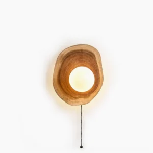 Eivor wooden wall sconce with asymmetrical design and frosted glass globe, isolated frontal view showing natural wood grain and minimalist Nordic aesthetic