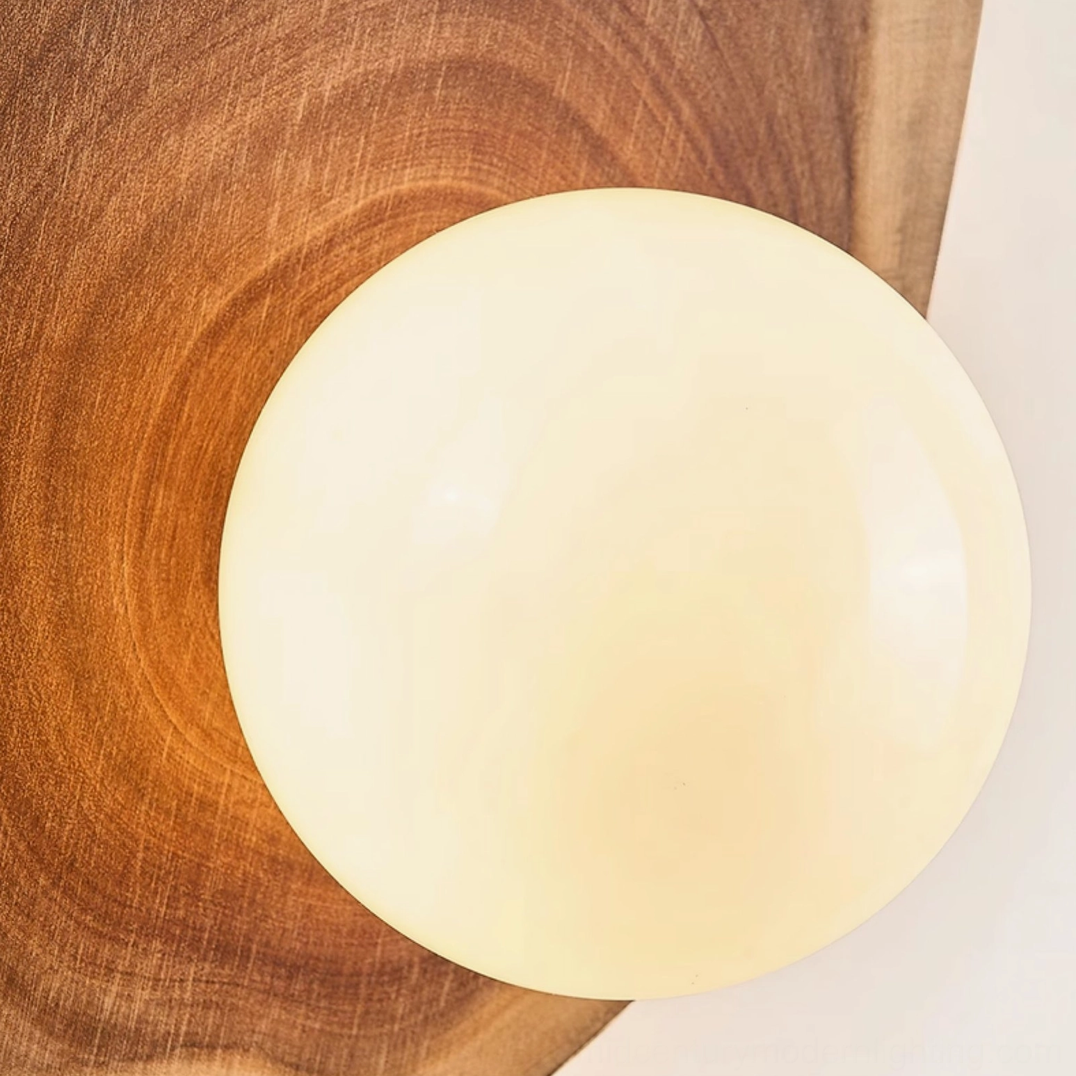 Eivor pull-chain wall sconce in white finish demonstrating clean Nordic minimalist aesthetic and organic asymmetrical wooden form