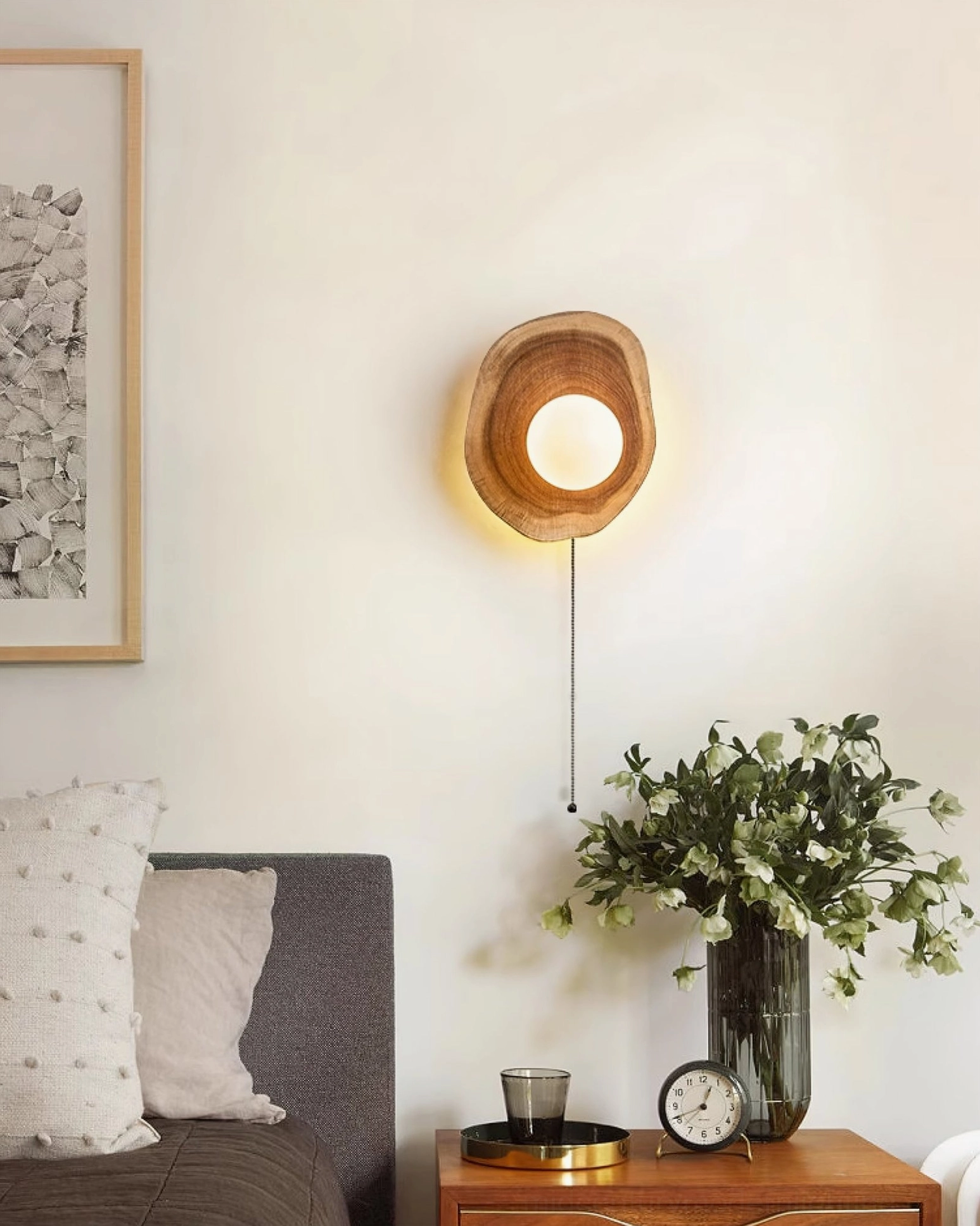 Eivor pull-chain wooden sconce in modern living room with sofa, side table and plants, demonstrating versatile Nordic minimalist interior design application