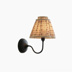Elbow wall sconce with pleated fabric shade and curved black metal arm, front view on white background