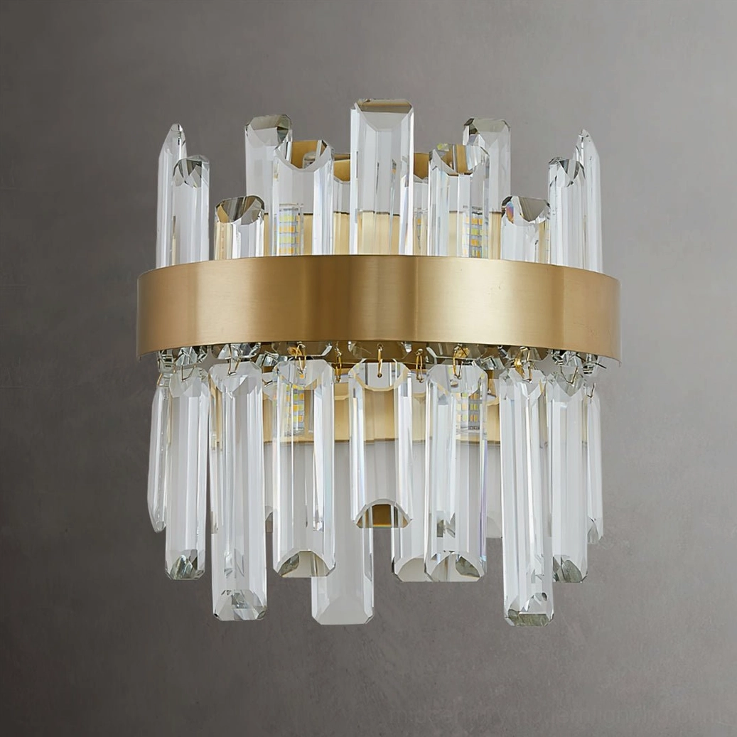 Elegant brass and crystal wall lamp mounted on neutral wall, showcasing minimalist aesthetic and functional design elegance