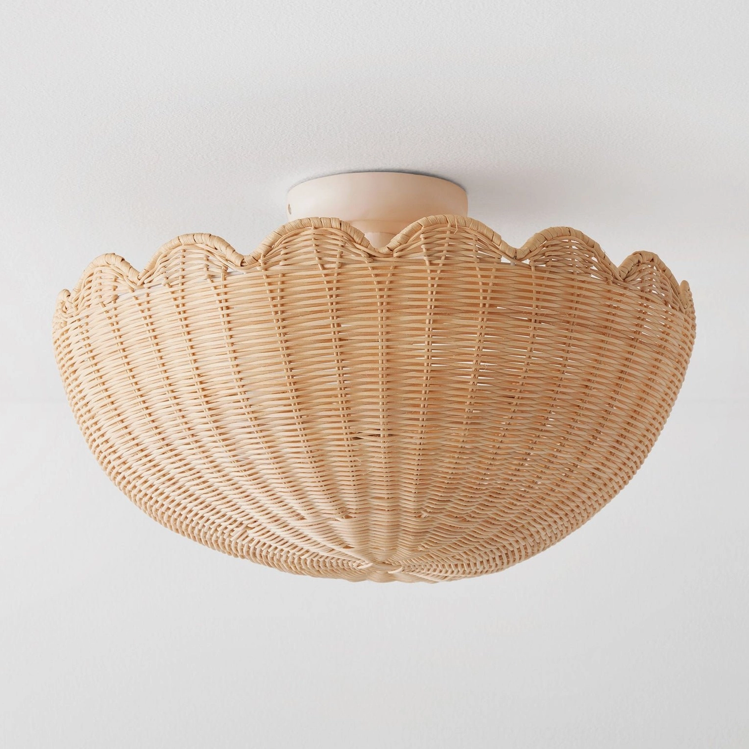 Compact scalloped boho rattan flush mount ceiling light - three-quarter front view showing elegant minimalist design