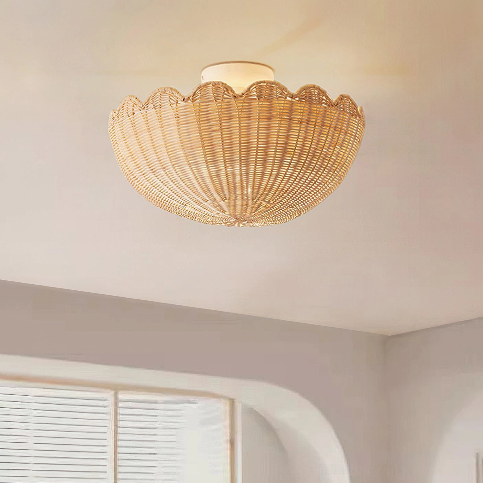 Elior rattan ceiling lamp installed in modern minimalist bedroom with arched window - coastal bohemian lighting aesthetic