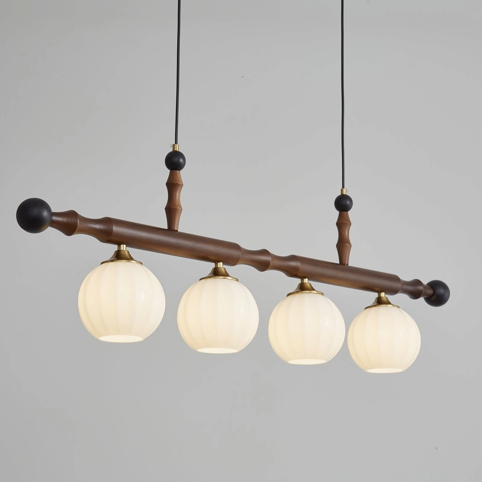 Elisha 4-light linear chandelier mounted on ceiling showing walnut wood beam and metal hardware connection